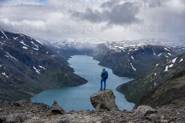 Hiker stands on rocks