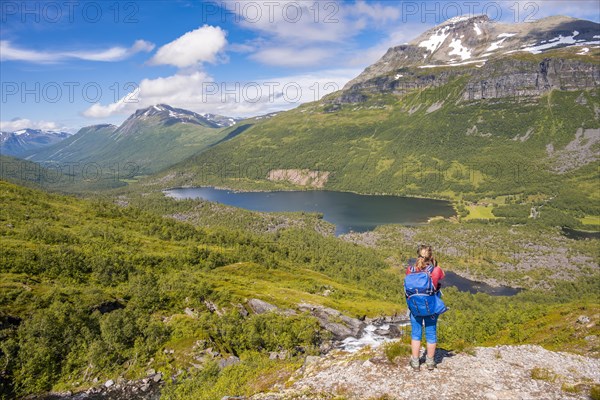 Hiker on a hiking trail to Innerdalstarnet