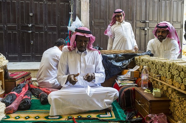 Man selling chewing sticks