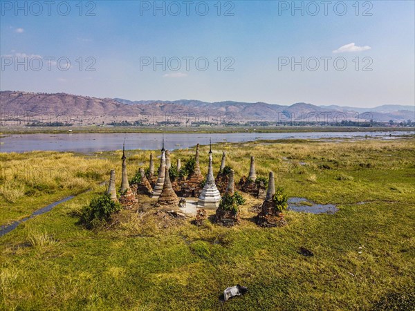 Aerial of little pagodas sitting in the waters of the southern Inle lake