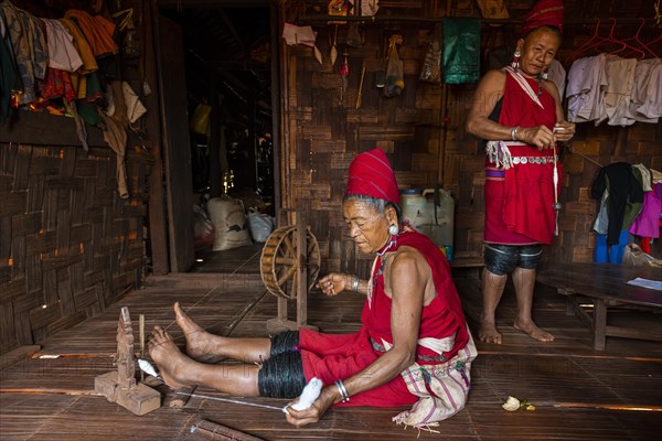 Old Kayan women weaving the traditional way