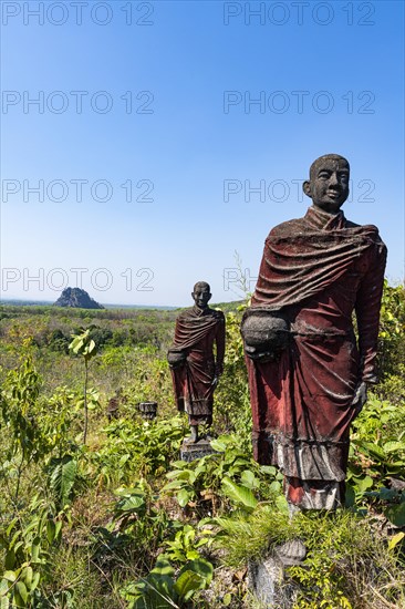 Huge line of monk statues in Win Sein Taw Ya outside Mawlamyine