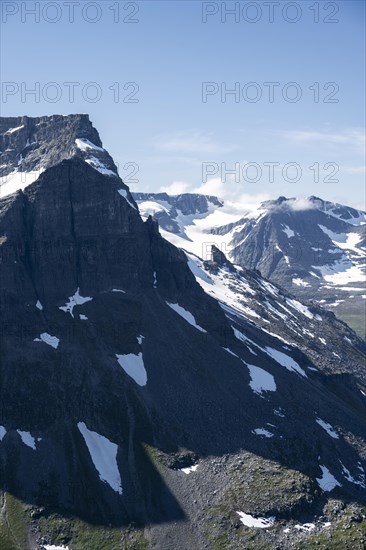 Snow covered mountain slope of Skarfjell mountain and Hesten