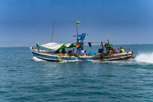 Sea gypsies Moken on their fishing boat