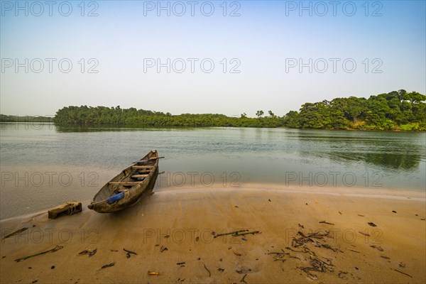 Dugout on the river near the ocean