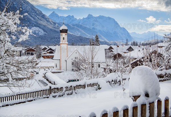 Village view with parish church and Karwendel mountains