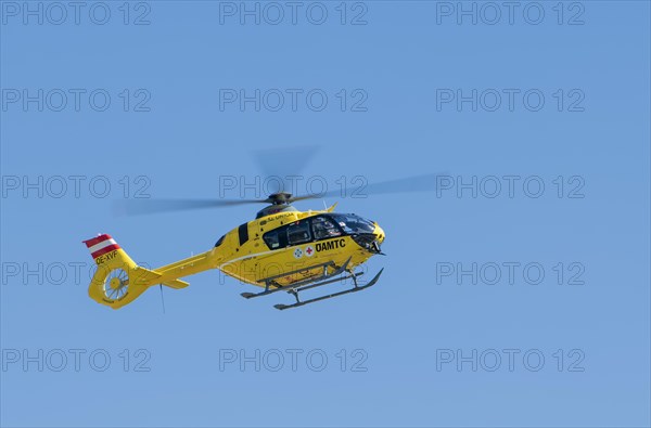 The OeAMTC rescue helicopter Christophorus 14 of the type Eurocopter 135 flies near its base in Oeblarn