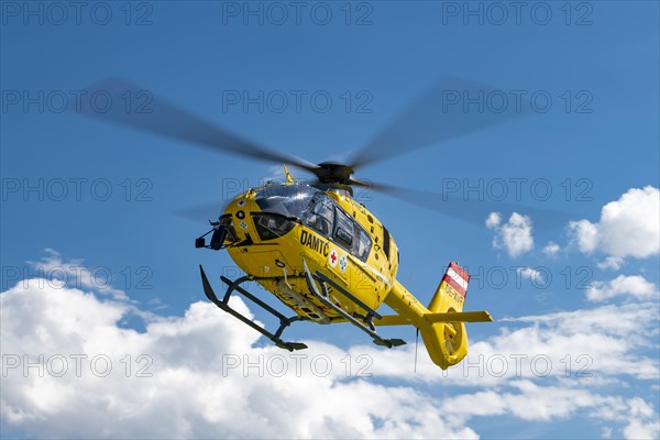 The OeAMTC rescue helicopter Christophorus 14 of the type Eurocopter 135 flies near its base in Oeblarn