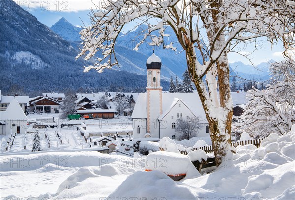 Village view with parish church and Karwendel mountains