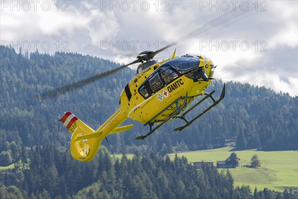 The OeAMTC rescue helicopter Christophorus 14 of the type Eurocopter 135 flies near its base in Oeblarn