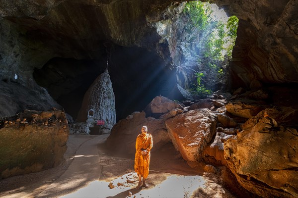 Monk standing in Saddan cave