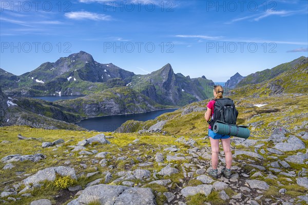 Hiker looks out over the lake Tennesvatnet