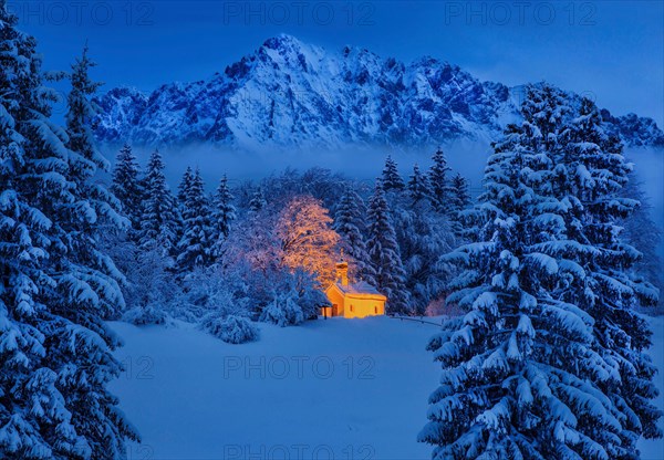 Chapel Maria Rast on the Buckelwiesen with Woerner 2474m in the Karwendel mountains at dusk