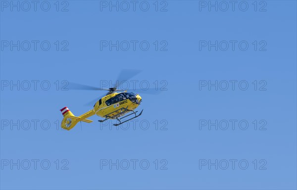 The OeAMTC rescue helicopter Christophorus 14 of the type Eurocopter 135 flies near its base in Oeblarn