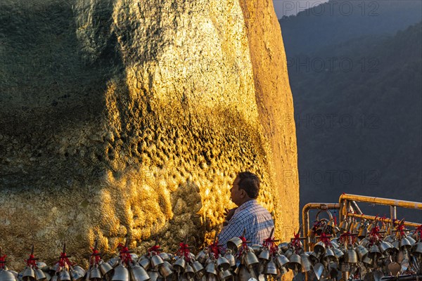 Pilgrim praying at the Kyaiktiyo Pagoda