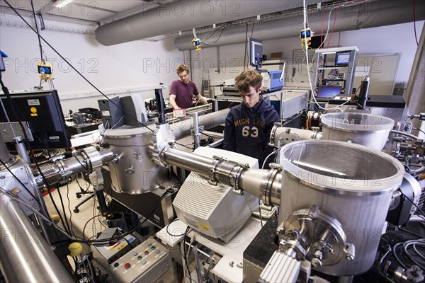 PhD student during his research work adjusting his experimental setup