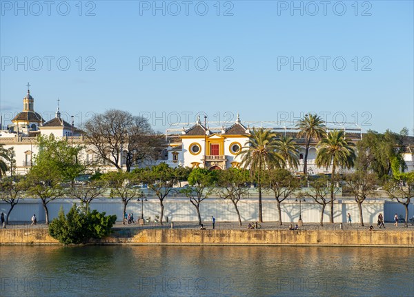 View over the river Rio Guadalquivir to the bullring Plaza de toros de la Real Maestranza de Caballeria de Sevilla