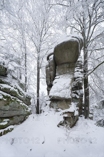 Rock formation at Rudolphstein with snow in winter