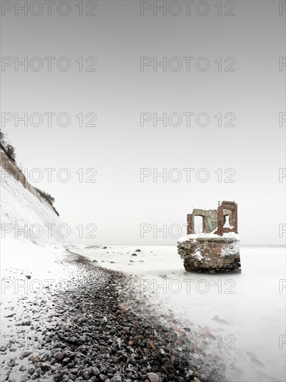 Old tide gauge house on the beach near Kap Arkona on the German island of Ruegen