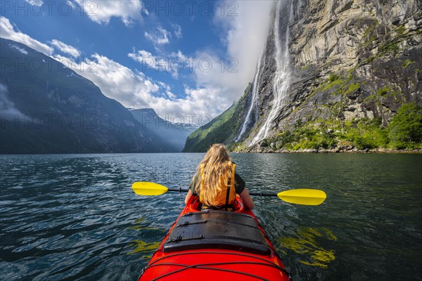 Young woman paddling in a kayak