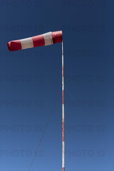 Inflated windsock in blue sky