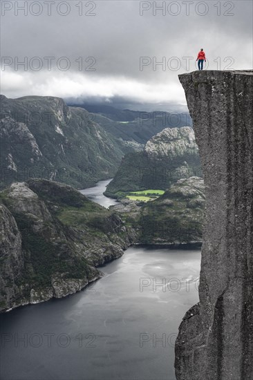 Person standing on steep cliff