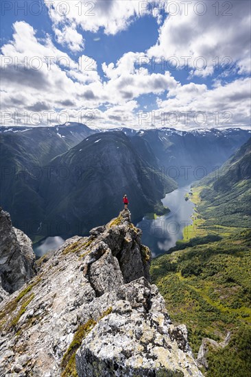 Hiker standing on rocky outcrop