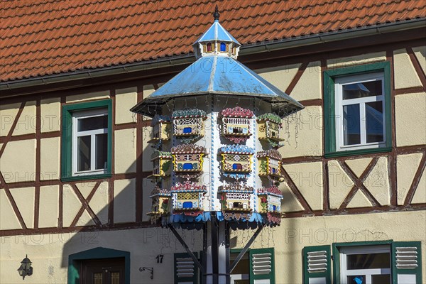 Artfully built dovecote in front of a farmhouse