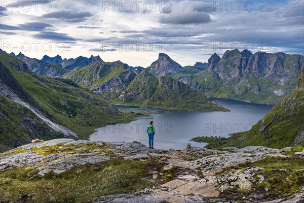 Hiker walks through mountain landscape