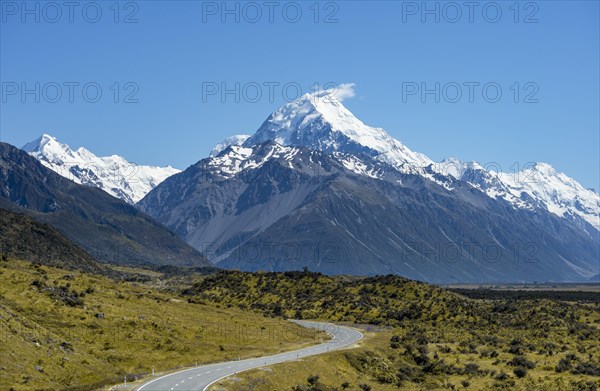 Country road overlooking snow-capped Mount Cook National Park