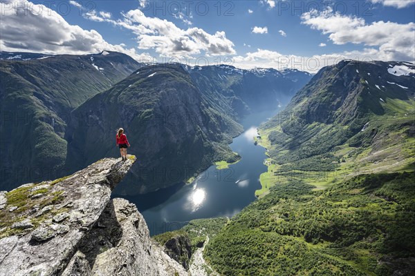 Hiker standing on rocky outcrop