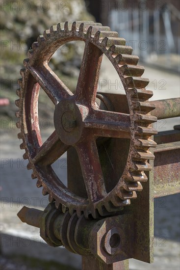 Rusty gear wheel of a weir