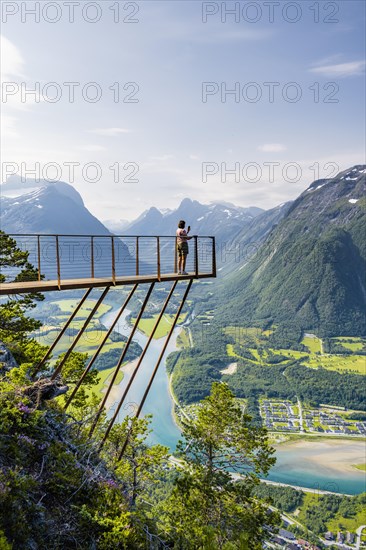 Hikers standing on viewing platform Rampestreken