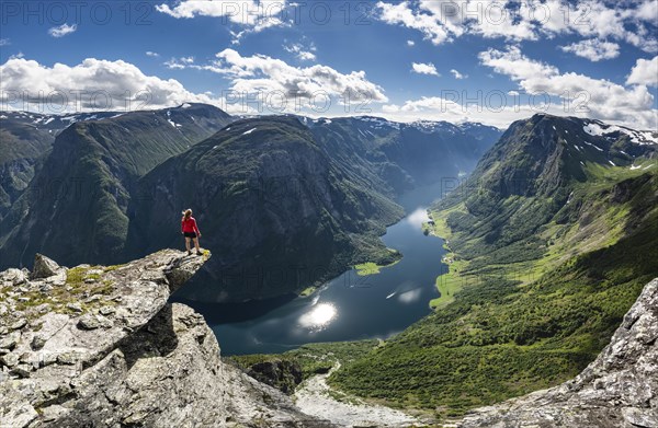 Hiker standing on rocky outcrop