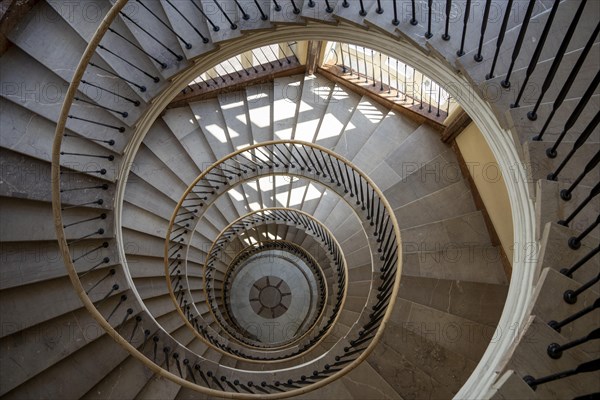 Beautiful winding staircase in old tenement house in Warsaw