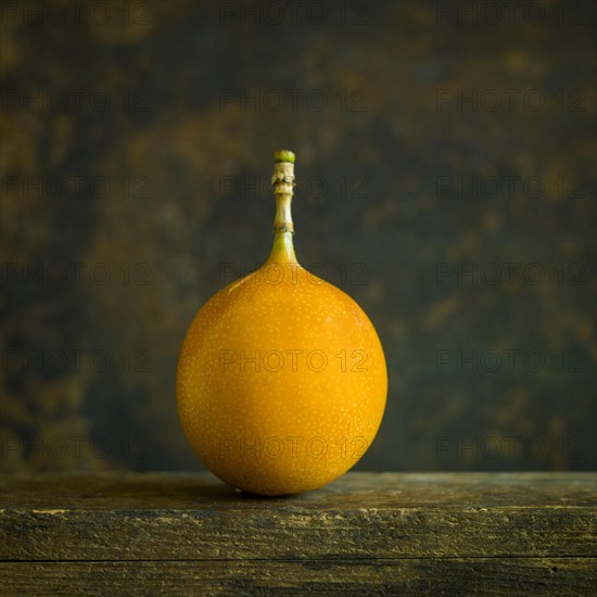 Grenadilla. Passion fruit on brown background