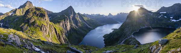 Hiker looking at mountain landscape with fjord Forsfjorden