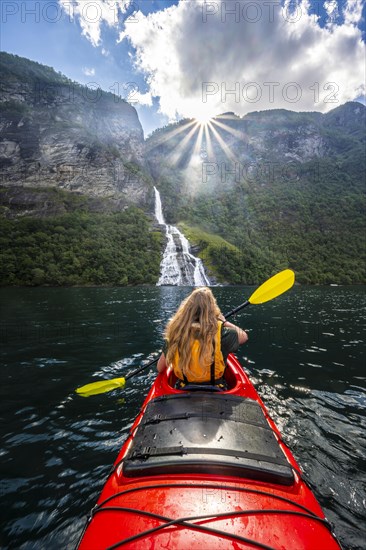 Young woman paddling in a kayak