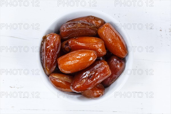 Dates dried fruits fruit from top wooden board