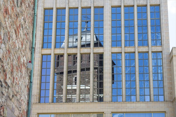 Reflection of the Red Tower in the glass facade of the Galerie Roter Turm