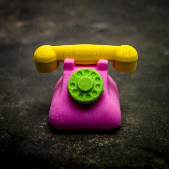 Eraser representing a phone on a textured background