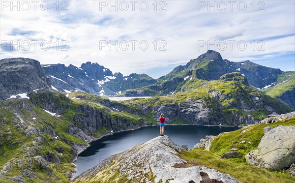 Hiker looking over lake Tennesvatnet