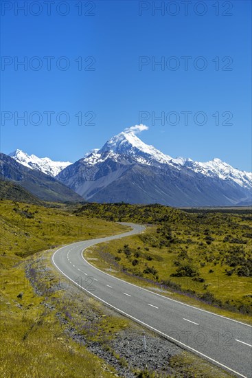 Country road overlooking snow-capped Mount Cook National Park