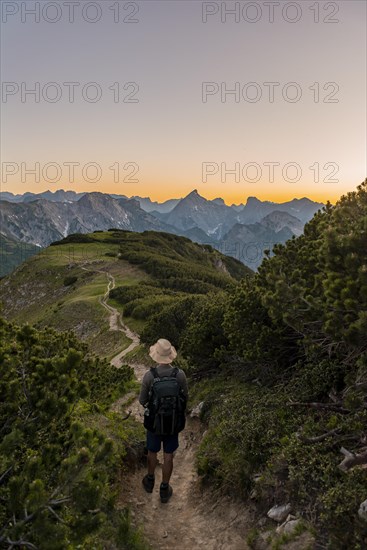 Hiker on hiking trail at Baerenkopf