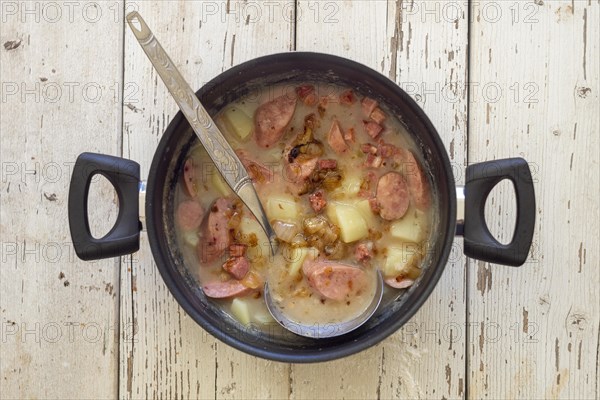 Traditional polish sour soup called zurek in a pot