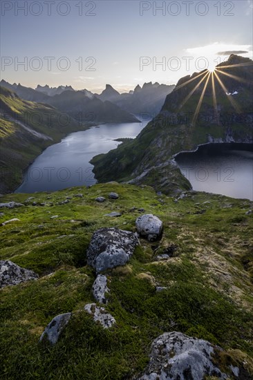 Sun shining over mountain landscape with fjord Forsfjorden and lake Krokvatnet