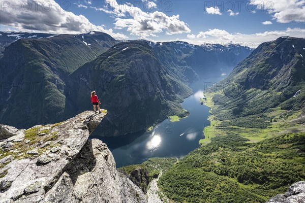 Hiker standing on rocky outcrop