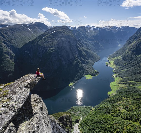 Hiker sitting on rock