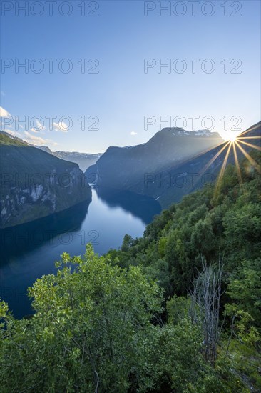 Sun shining over mountain ridge