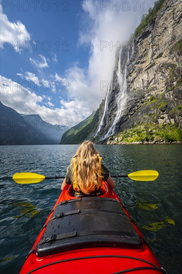 Young woman paddling in a kayak